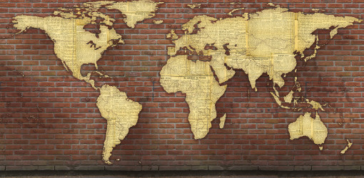 Карта мира из газет на кирпичной стене